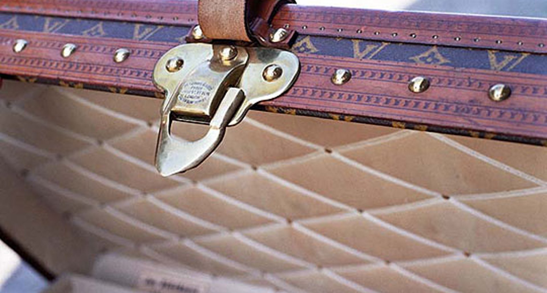 Sold at Auction: VINTAGE LOUIS VUITTON LUGGAGE SERIAL DATE CODE UNDER  BUCKLE STRAP