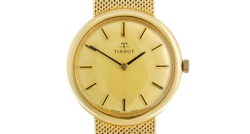 A 14k yellow gold manual wind gentleman s Tissot bracelet watch