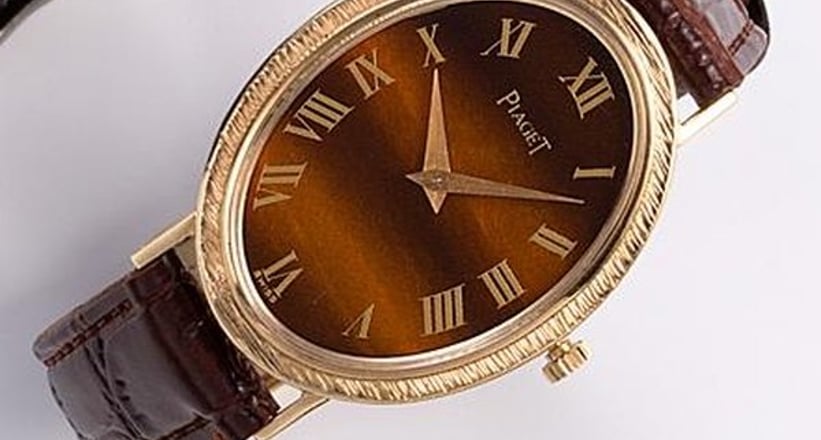 Piaget A lady s 18K gold and tiger s eye manual wind wristwatch