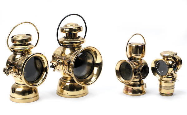 Four early motoring brass lamps | Classic Driver Market