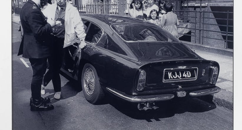 A Photoprint With Signature Of Mick Jagger And His Aston Martin Db6